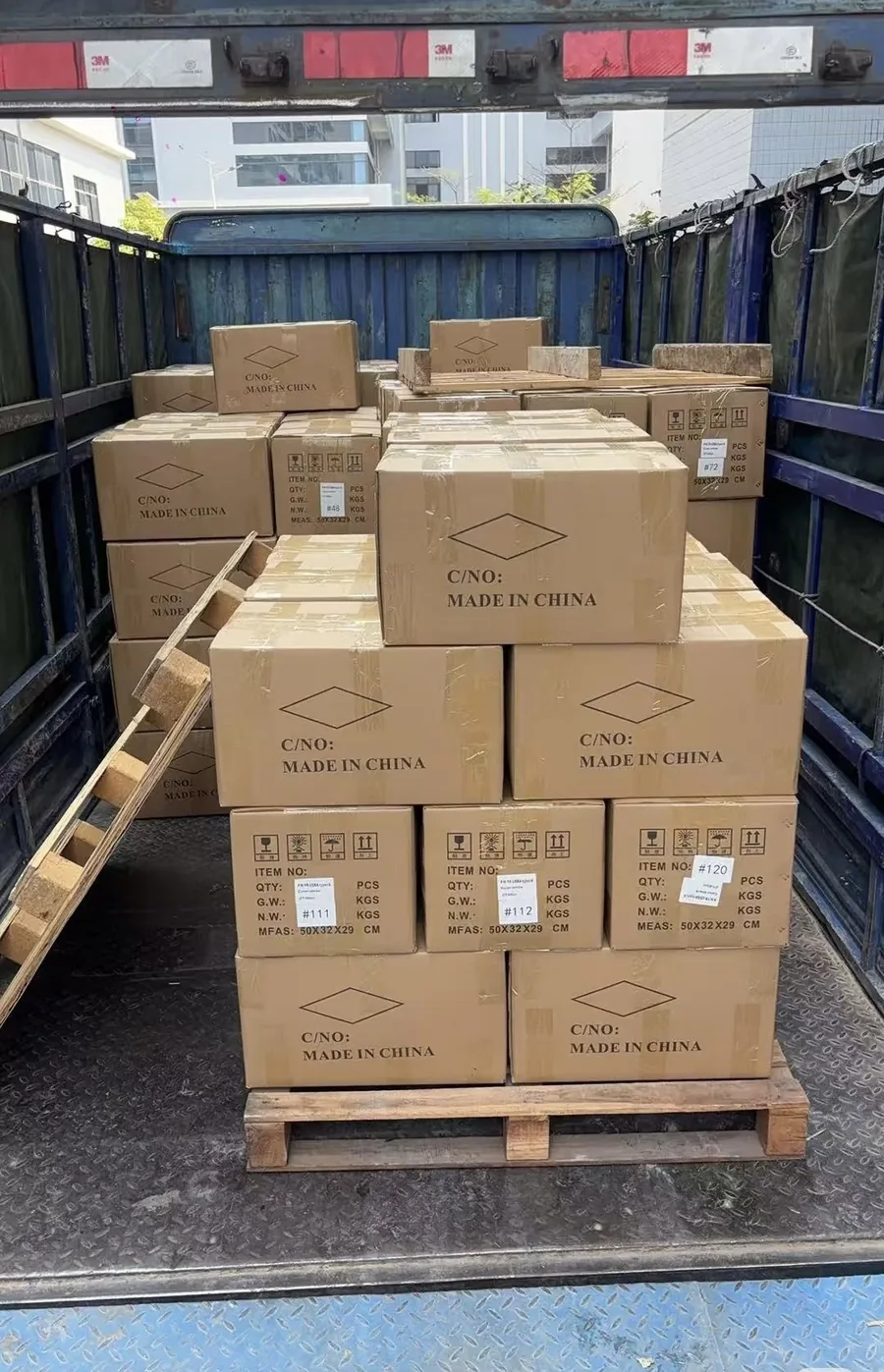 Export cartons of hand tool sets loaded into a container truck, ready for shipment